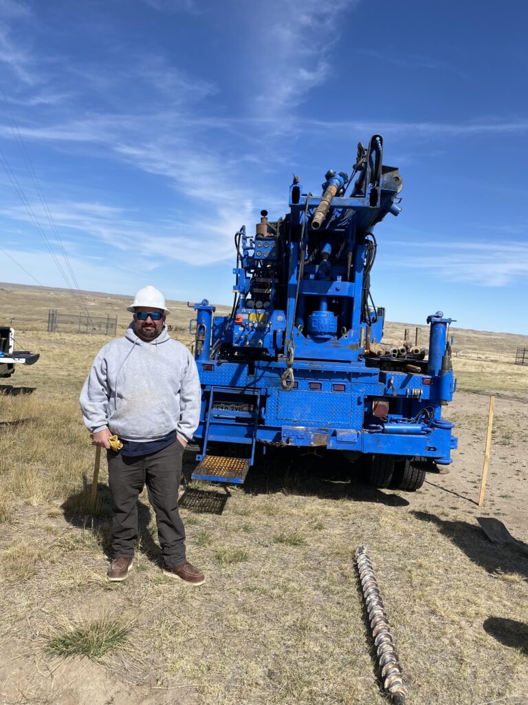 CEO Jared Jung standing in front of drilling machinery