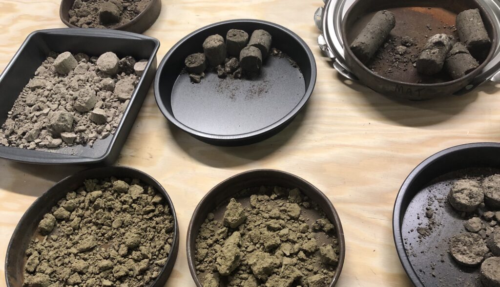 Soil testing samples separated into different metal tins