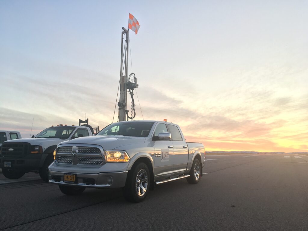 White Dodge Ram work truck lineup at JB Engineers